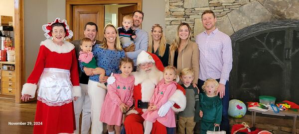 Extended family with Santa and Mrs. Claus