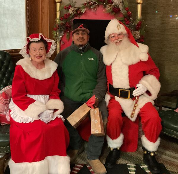 Guest with Santa and Mrs. Claus
