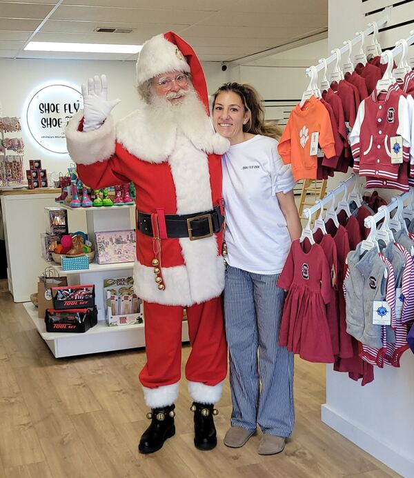 Santa Truette visiting a local boutique