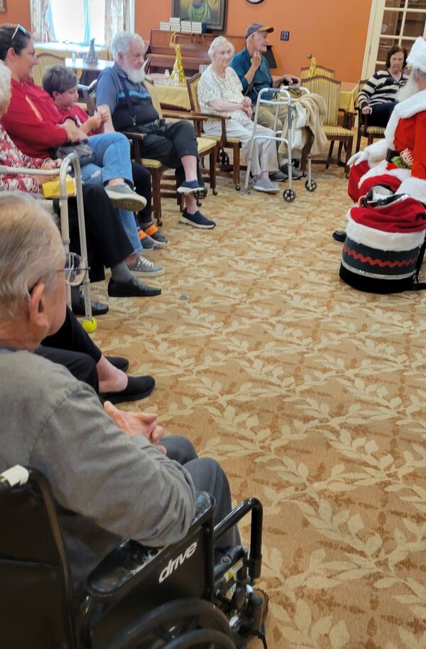 Santa and Mrs. Claus visiting a retirement community