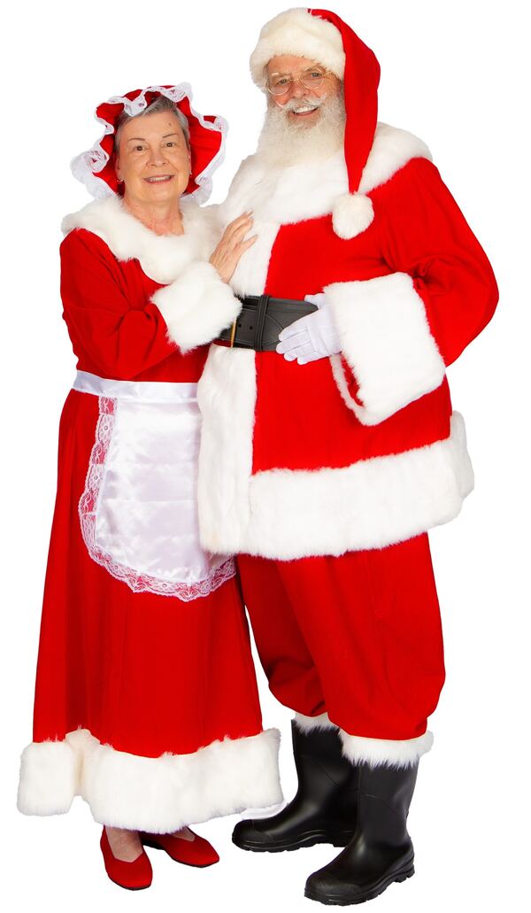 Full-length portrait of Mrs. Claus Nancy and Santa Truette