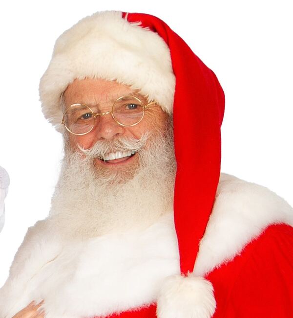 Head-and-shoulders portrait of a smiling Santa Truette