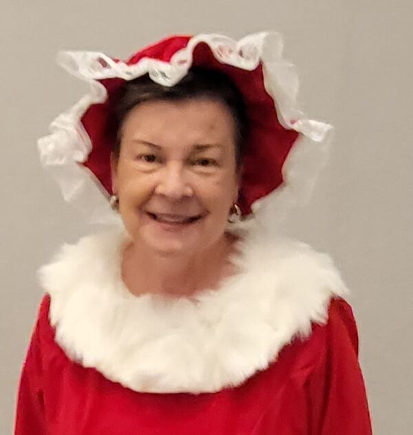 Mrs. Claus Nancy smiling in her ruffled bonnet