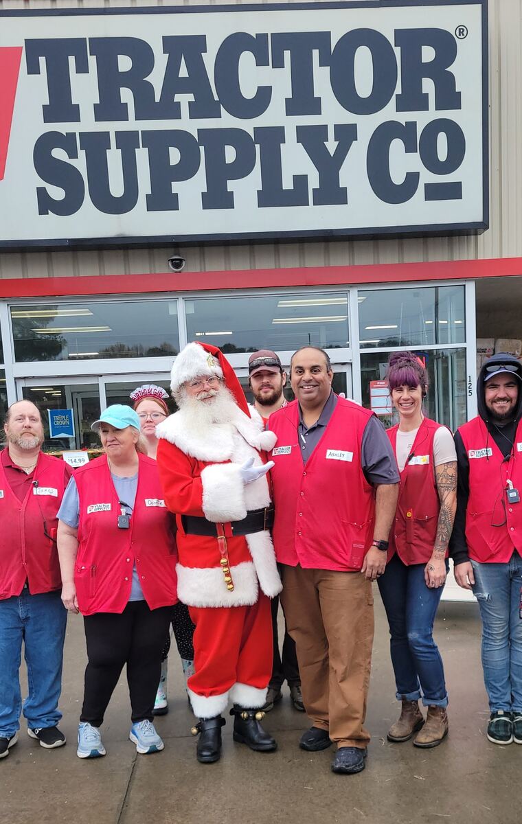 Santa with the Tractor Supply Co. team outside their store